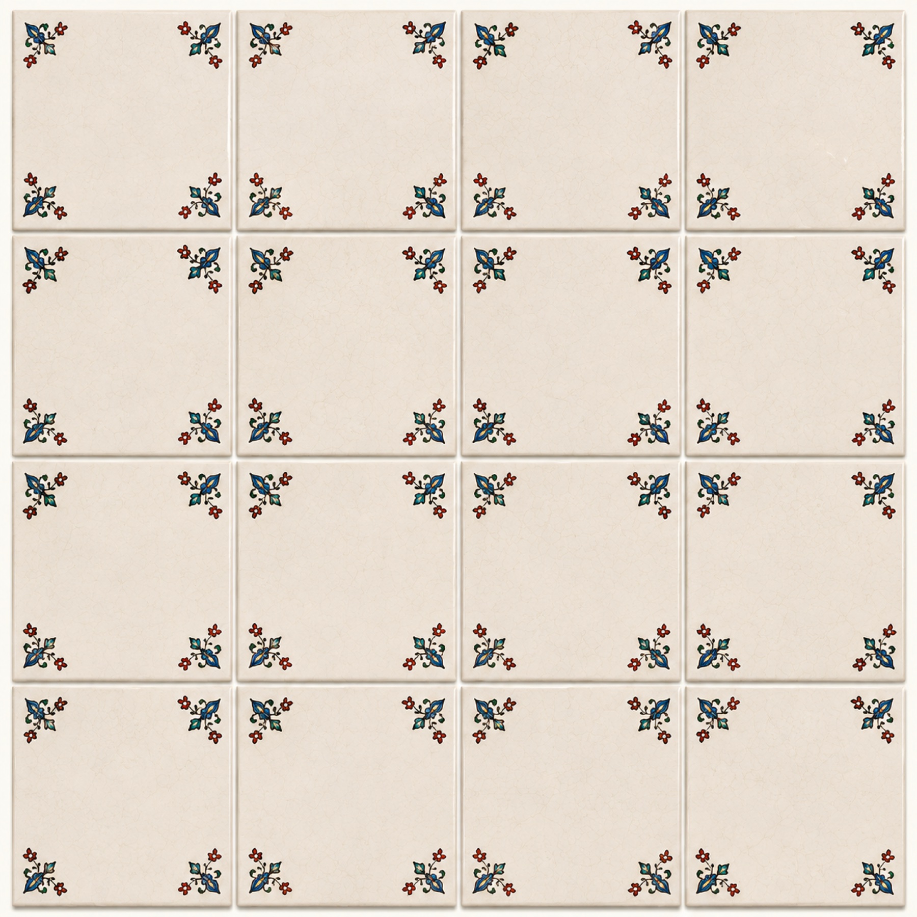 Set of sixteen ivory ceramic tiles with delicate floral corner details